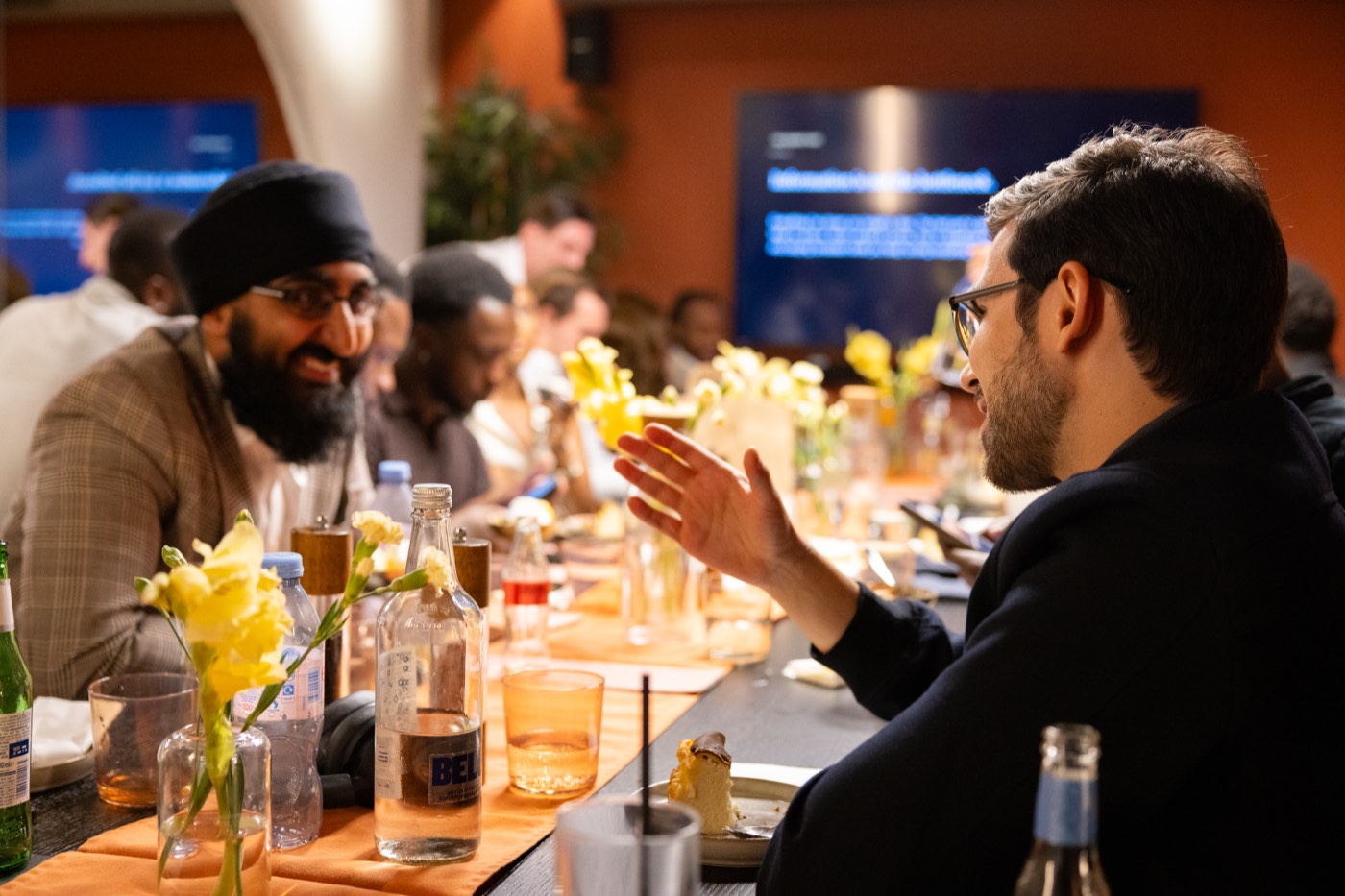 Two founders in conversation across the table